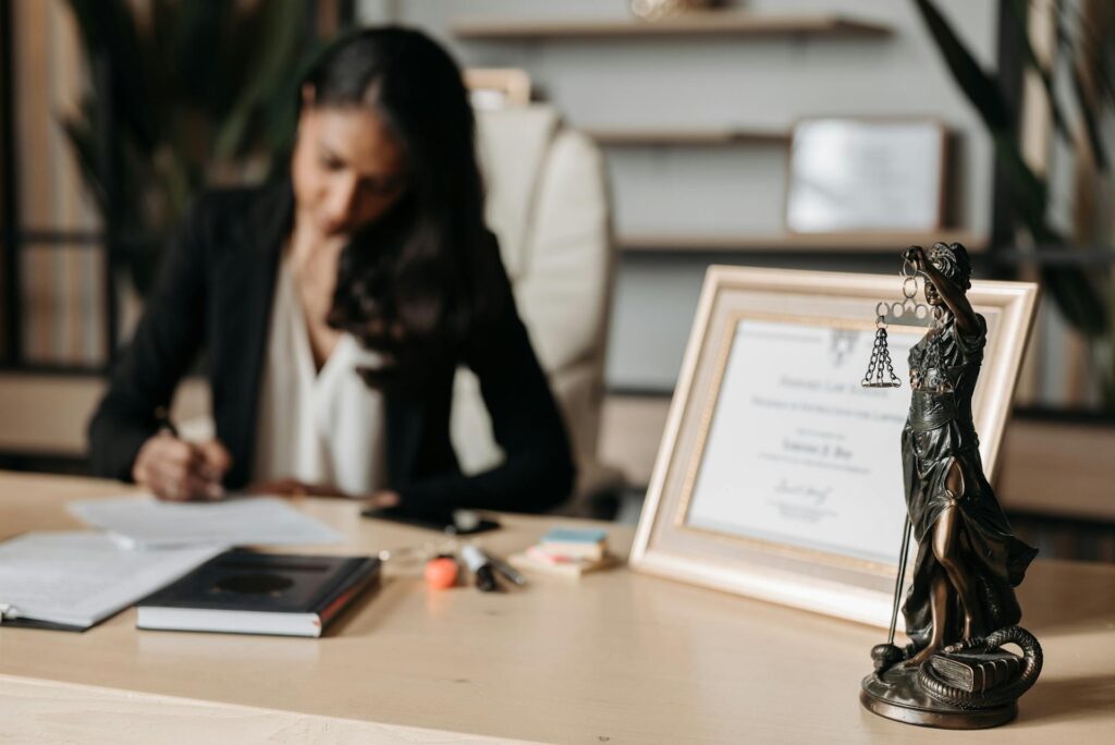 A female lawyer sitting at a desk doing paperwork