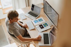 A man working at an ergonomic workstation at home